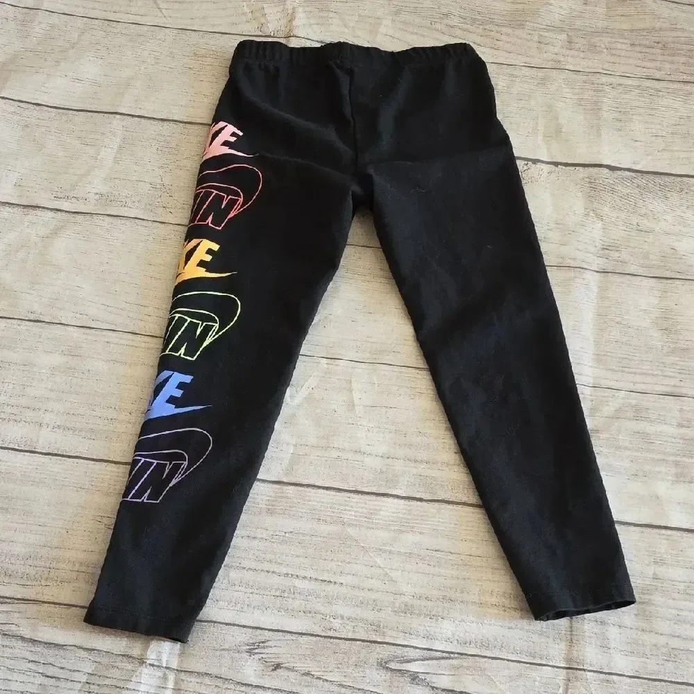 Nike Black and Pink Leggings with Bold Logo Design